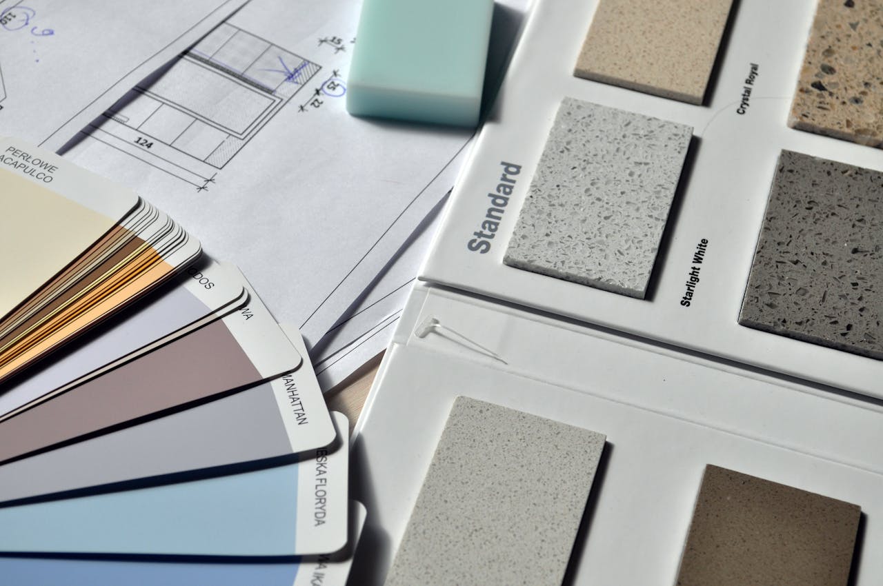 The Art of Drawing Readers In: Your attractive post title goes here Color palette and material samples for interior renovation projects on a blueprint.